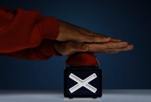 Side view hands pressing buzzer in warning to not mix chemicals